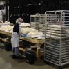 factory worker baking with shopcraft racks