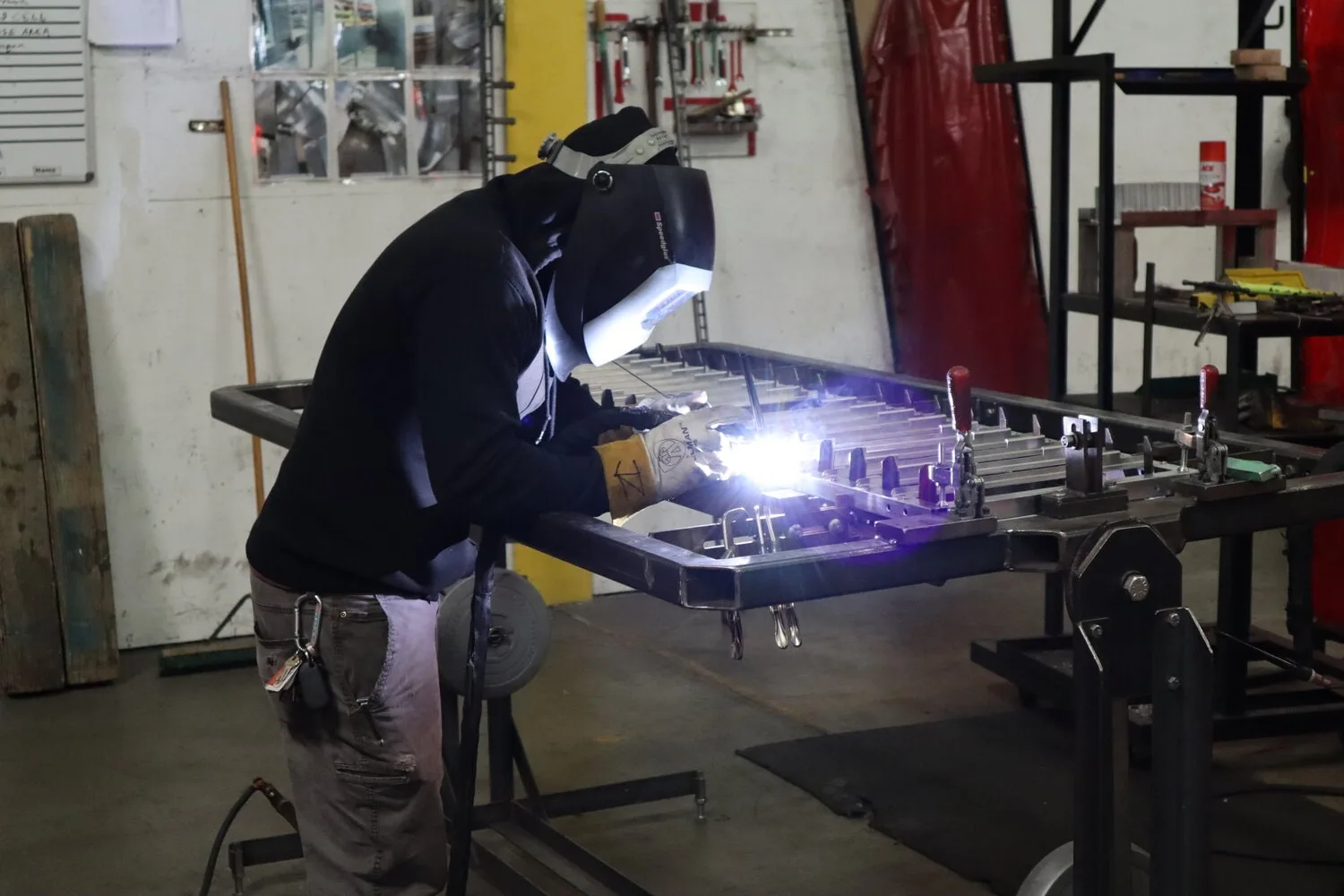 Metal fabricator welding bakery racks