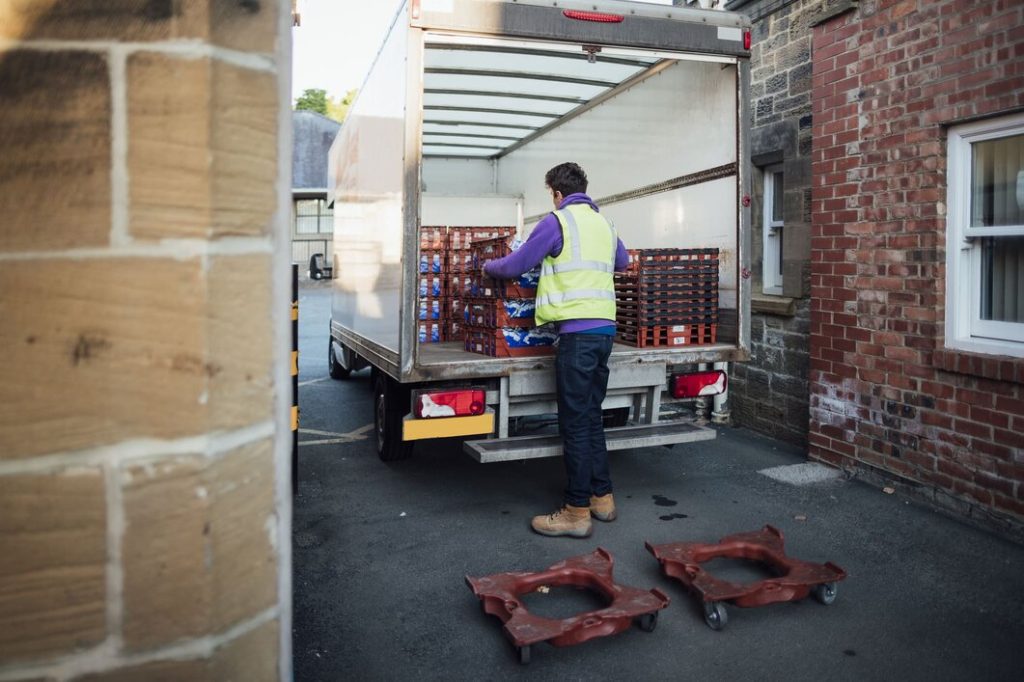offloading food crates from cold storage truck