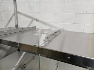 plexiglass spacers on steel food storage rack